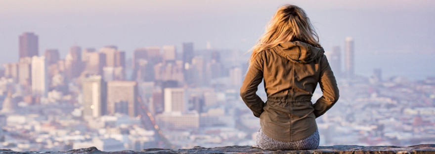Woman overlooking a city